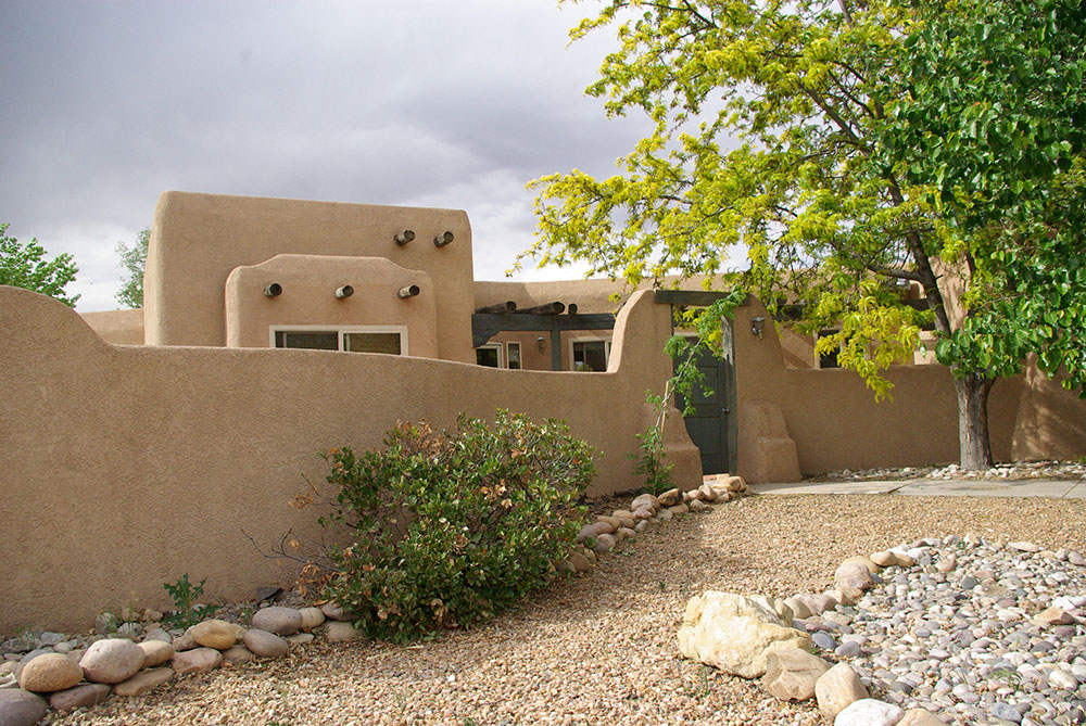 Restucco performed by B.W.Earp on luxury Albuquerque home and surrounding wall