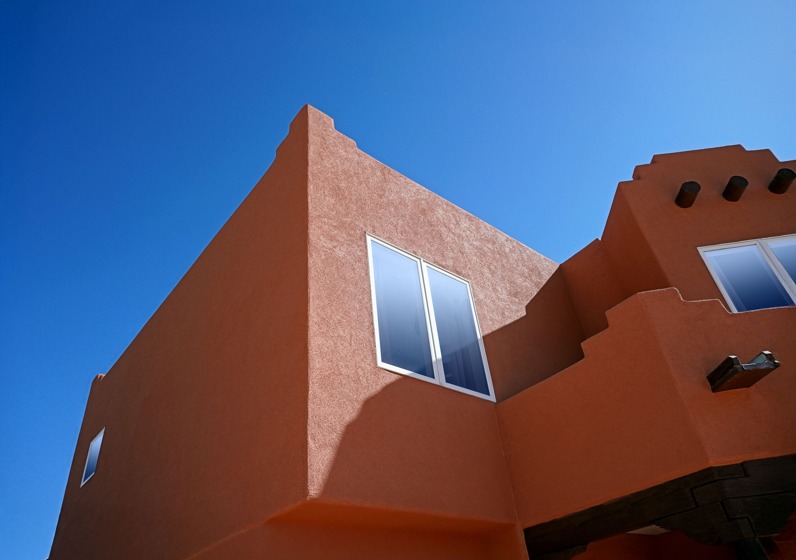 Beautifully restuccoed flat-roof home in Rio Rancho expertly repaired by B.W.Earp