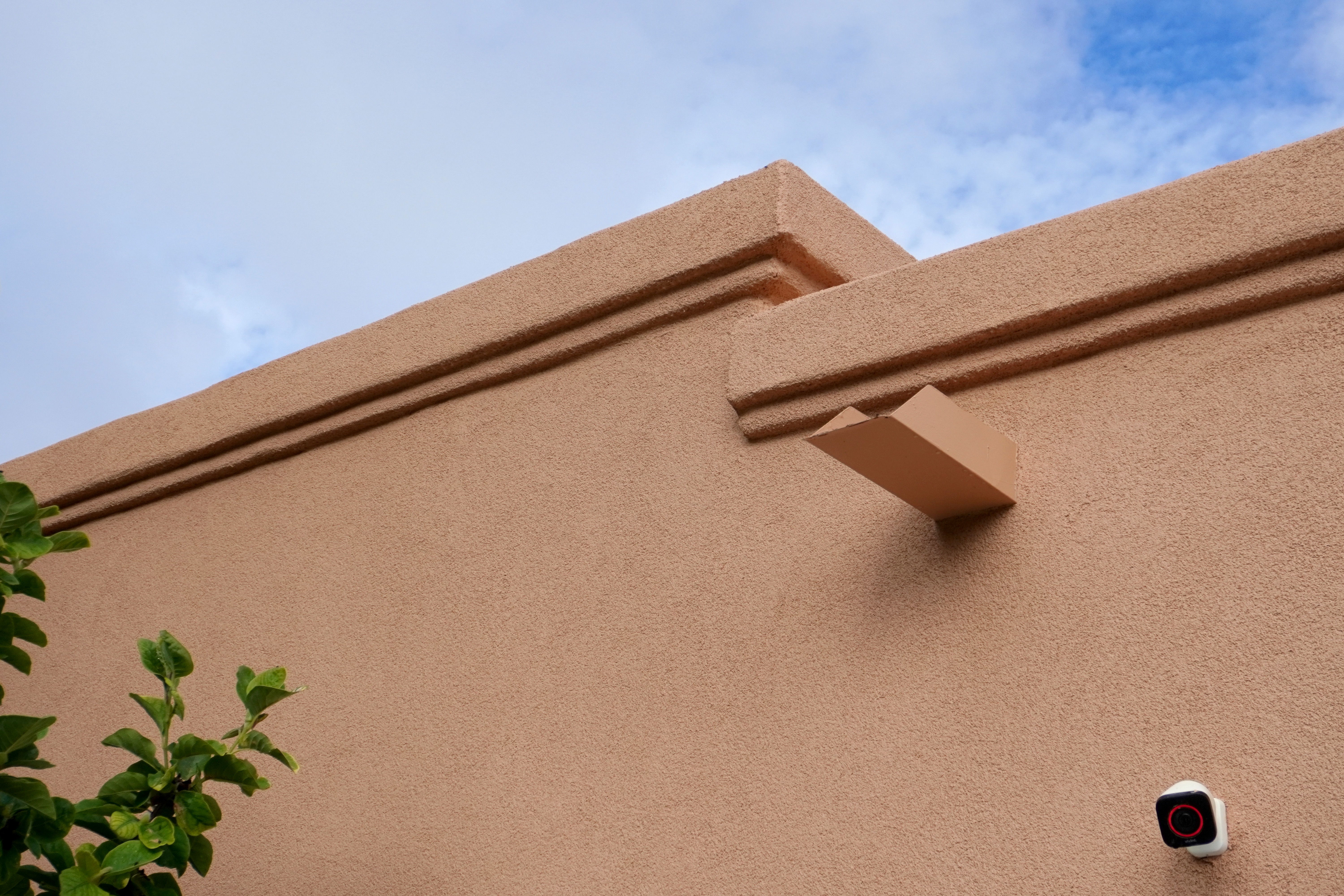 Newly repaired parapets of a flat roofed home that were refurbished as part of a full-home restucco in Albuquerque